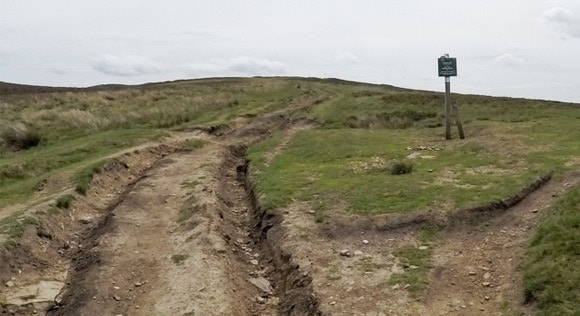 Signpost and damaged path to Win Hill