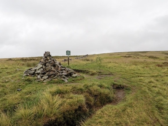 cairns and signpost